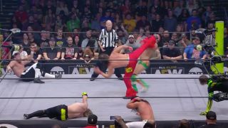A Swinging DDT turns into a super kick to the face from The Young Bucks