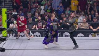 Jon Moxley interrupts Peter Avalon with a kick and a slam