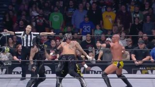 Pentagon takes a destroyer over the top from SCU’s Kazarian in the AEW World Tag Team Championship Tournament Finals