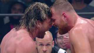 Jon Moxley and Kenny Omega go at it