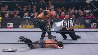 FULL GEAR: Moxley brings out his signature barbed-wire baseball-bat 